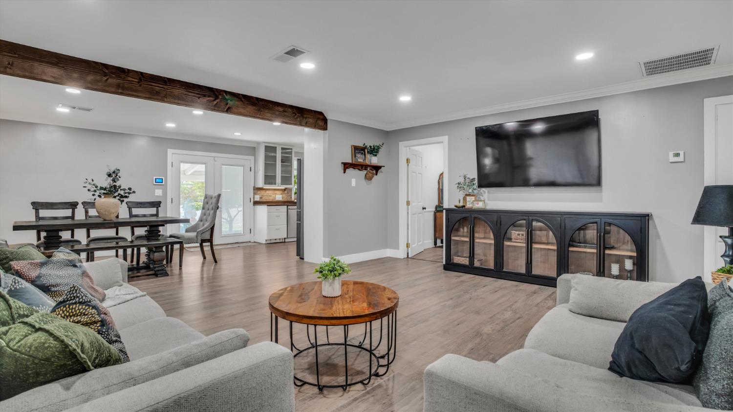 2331 East Woodson Road Acampo, CA 95220 - Photo 17 of 59 a living room with furniture and a flat screen tv