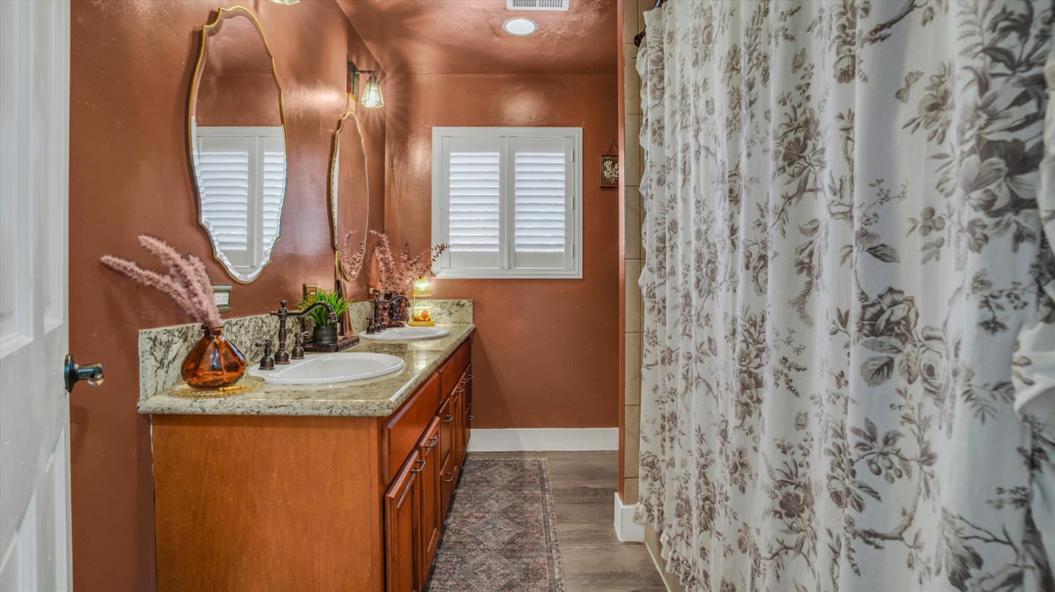 2331 East Woodson Road Acampo, CA 95220 - Photo 18 of 59 a bathroom with a sink and a mirror