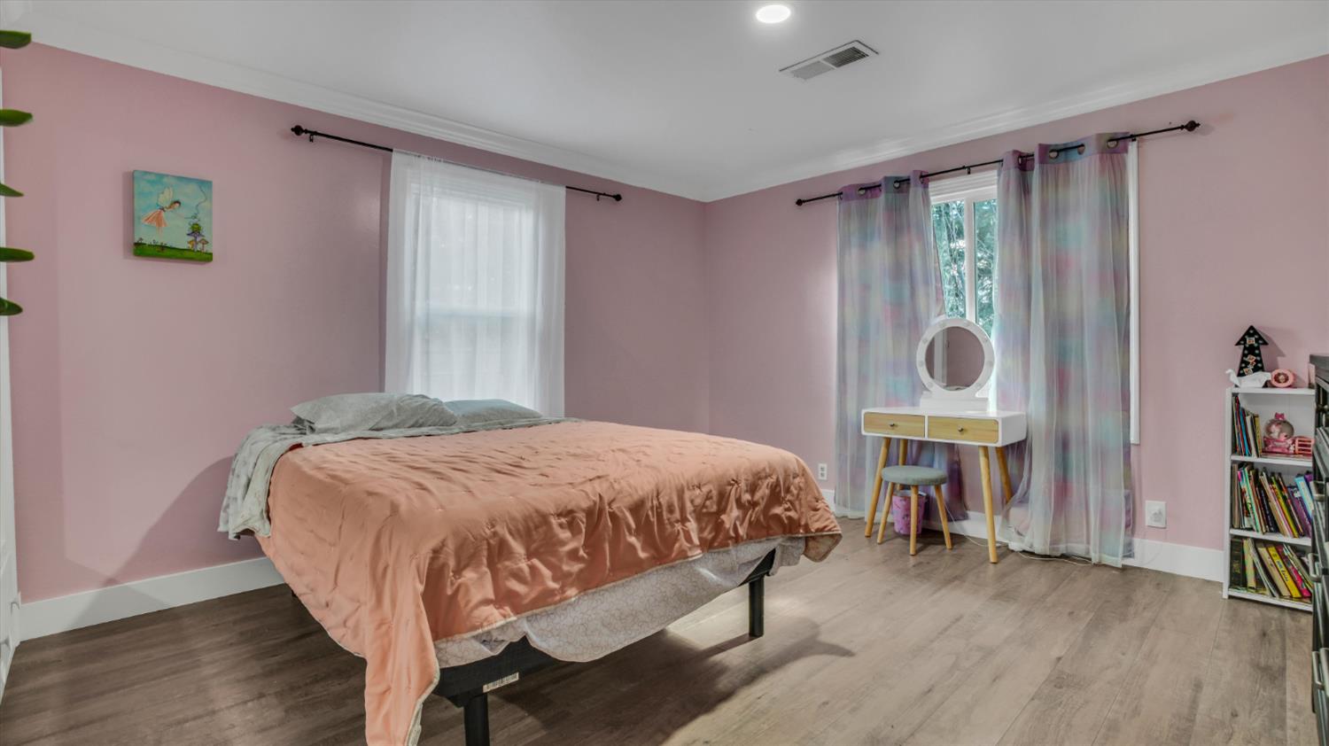 2331 East Woodson Road Acampo, CA 95220 - Photo 21 of 59 a bedroom with a bed table and a window