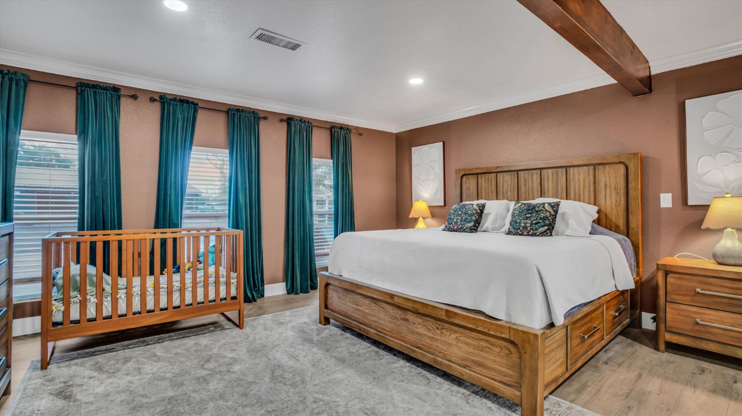 2331 East Woodson Road Acampo, CA 95220 - Photo 29 of 59 a bed sitting in a spacious bedroom next to a window