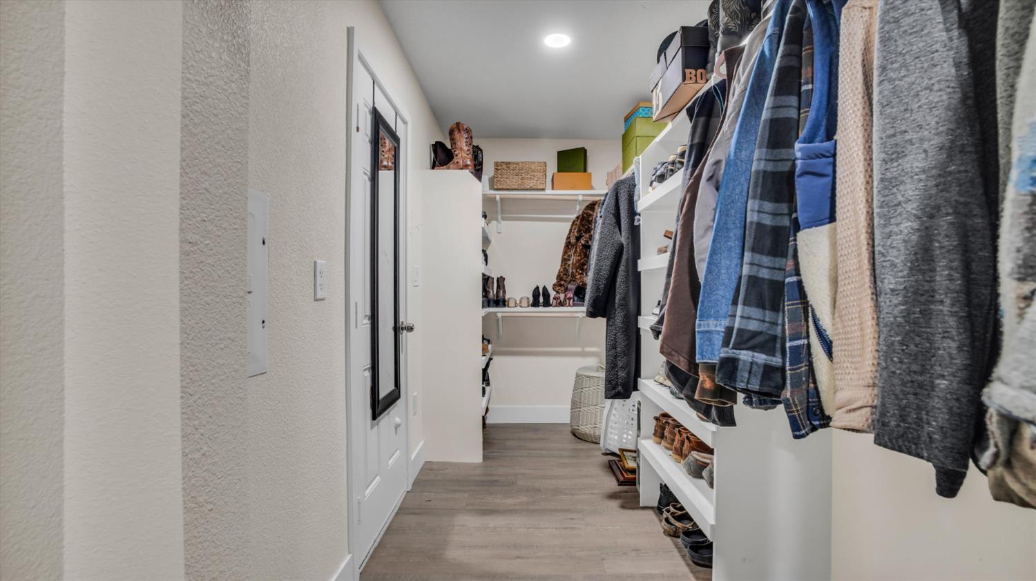 2331 East Woodson Road Acampo, CA 95220 - Photo 30 of 59 a view of a walk in closet