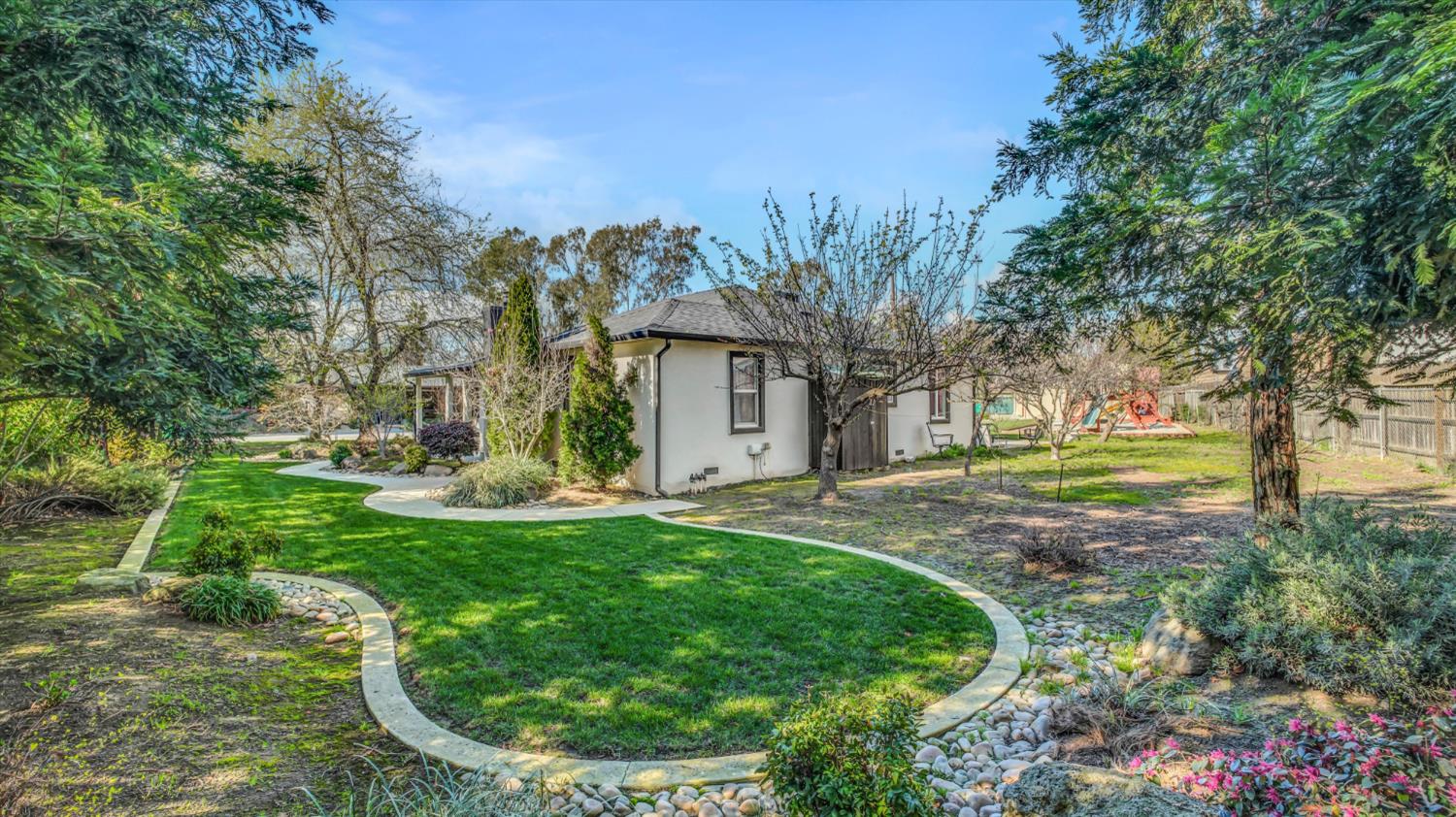 2331 East Woodson Road Acampo, CA 95220 - Photo 3 of 59 a view of a house with yard and tree s