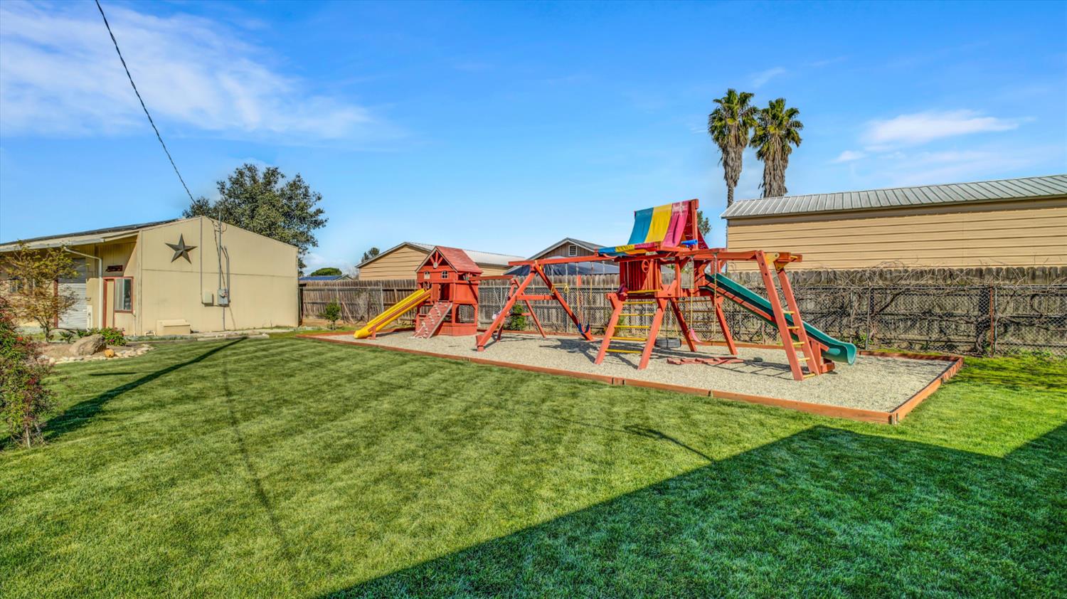 2331 East Woodson Road Acampo, CA 95220 - Photo 36 of 59 a view of a house with a yard and sitting area