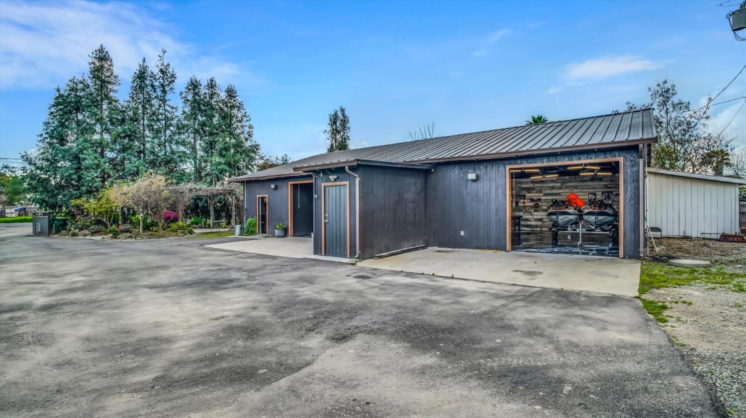 2331 East Woodson Road Acampo, CA 95220 - Photo 41 of 59 a front view of a house with a yard and garage