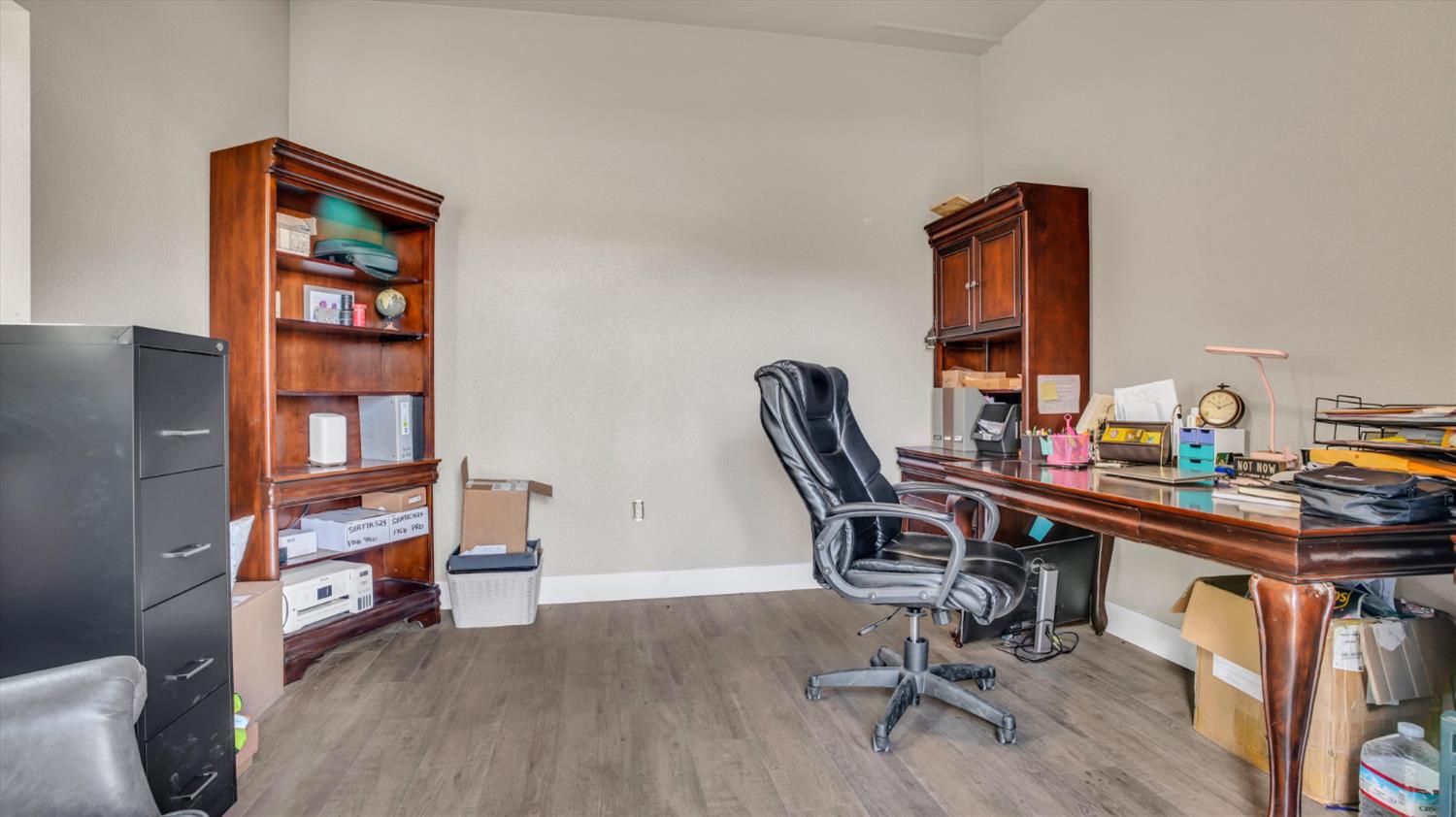 2331 East Woodson Road Acampo, CA 95220 - Photo 49 of 59 a view of a workspace with furniture and wooden floor