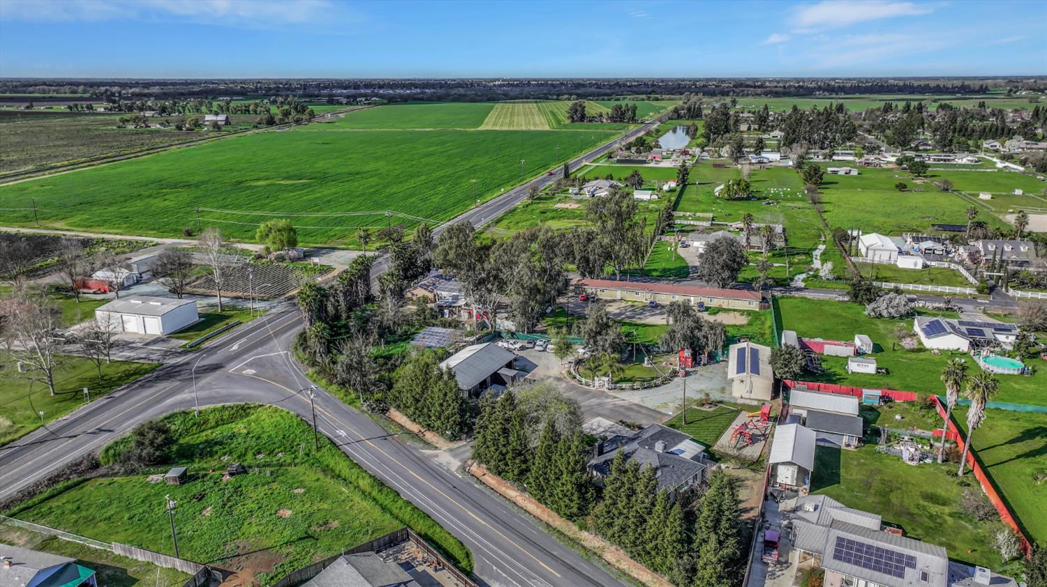 2331 East Woodson Road Acampo, CA 95220 - Photo 52 of 59 an aerial view of a residential houses with outdoor space and street view
