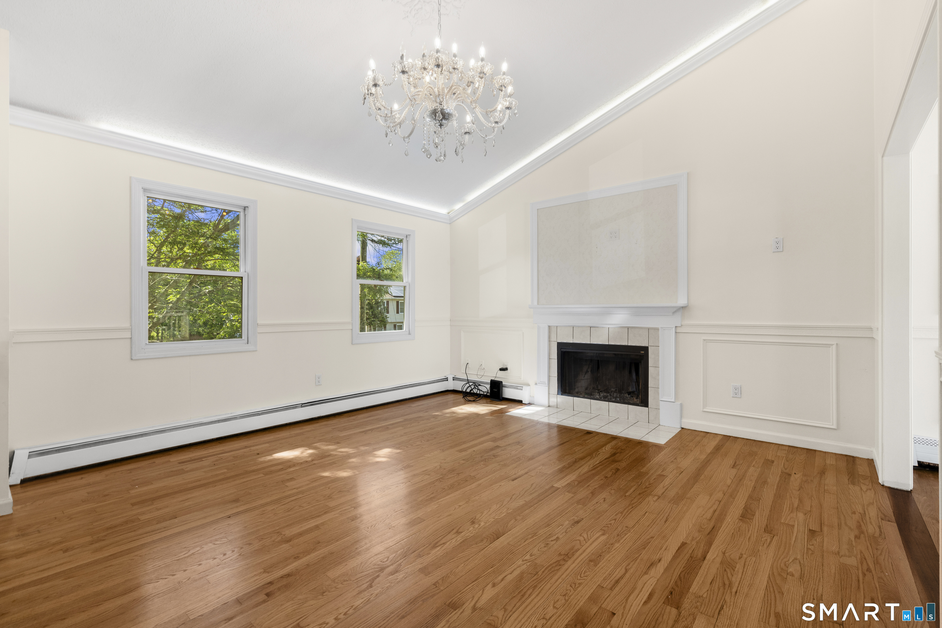 39 Joseph Lane Hamden, CT 06514 - Photo 13 of 40 an empty room with wooden floor fireplace and windows