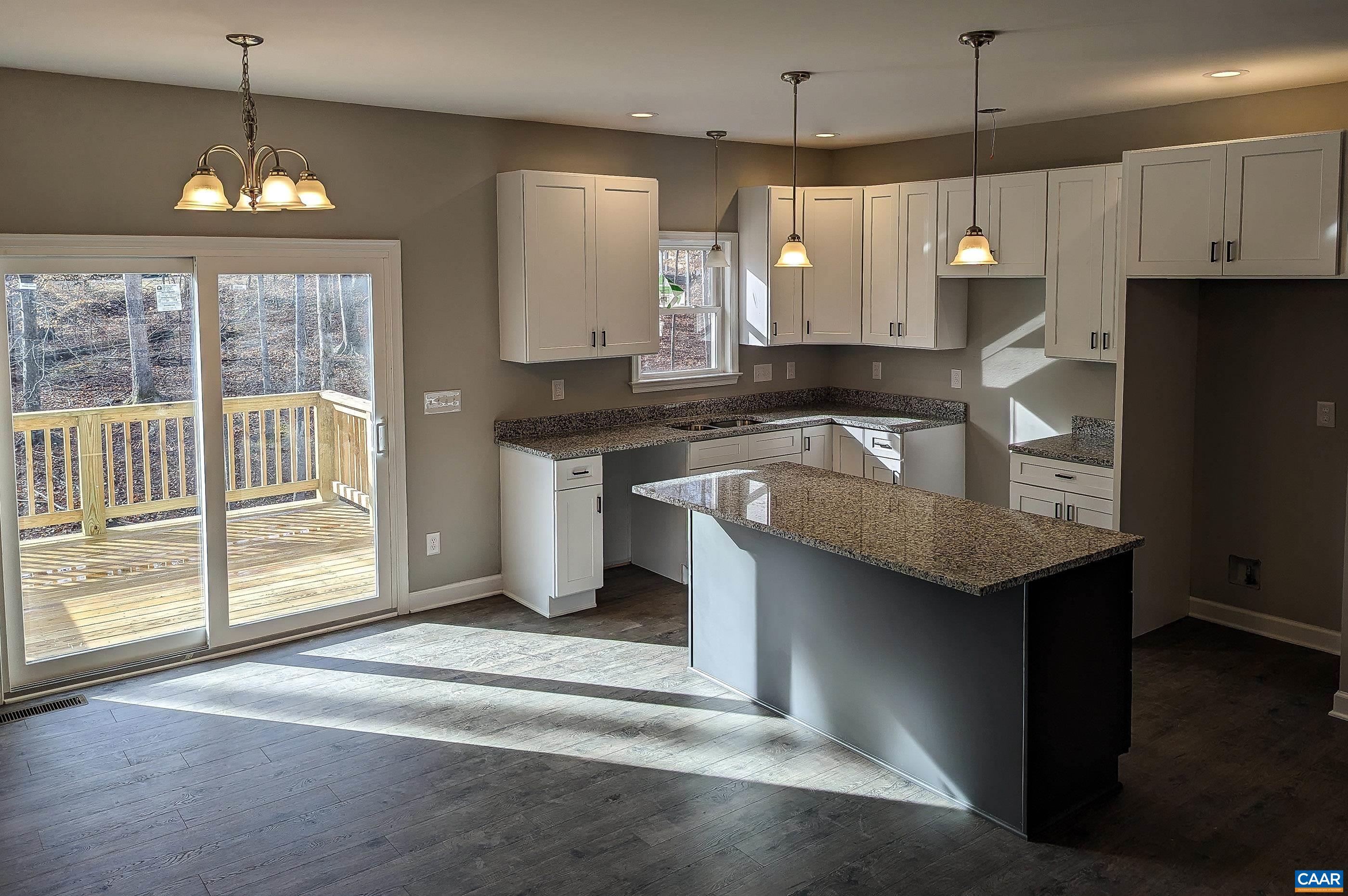 13 Amethyst Road Palmyra, VA 22963 - Photo 13 of 39 a kitchen with kitchen island granite countertop a stove a sink a center island and wooden floor