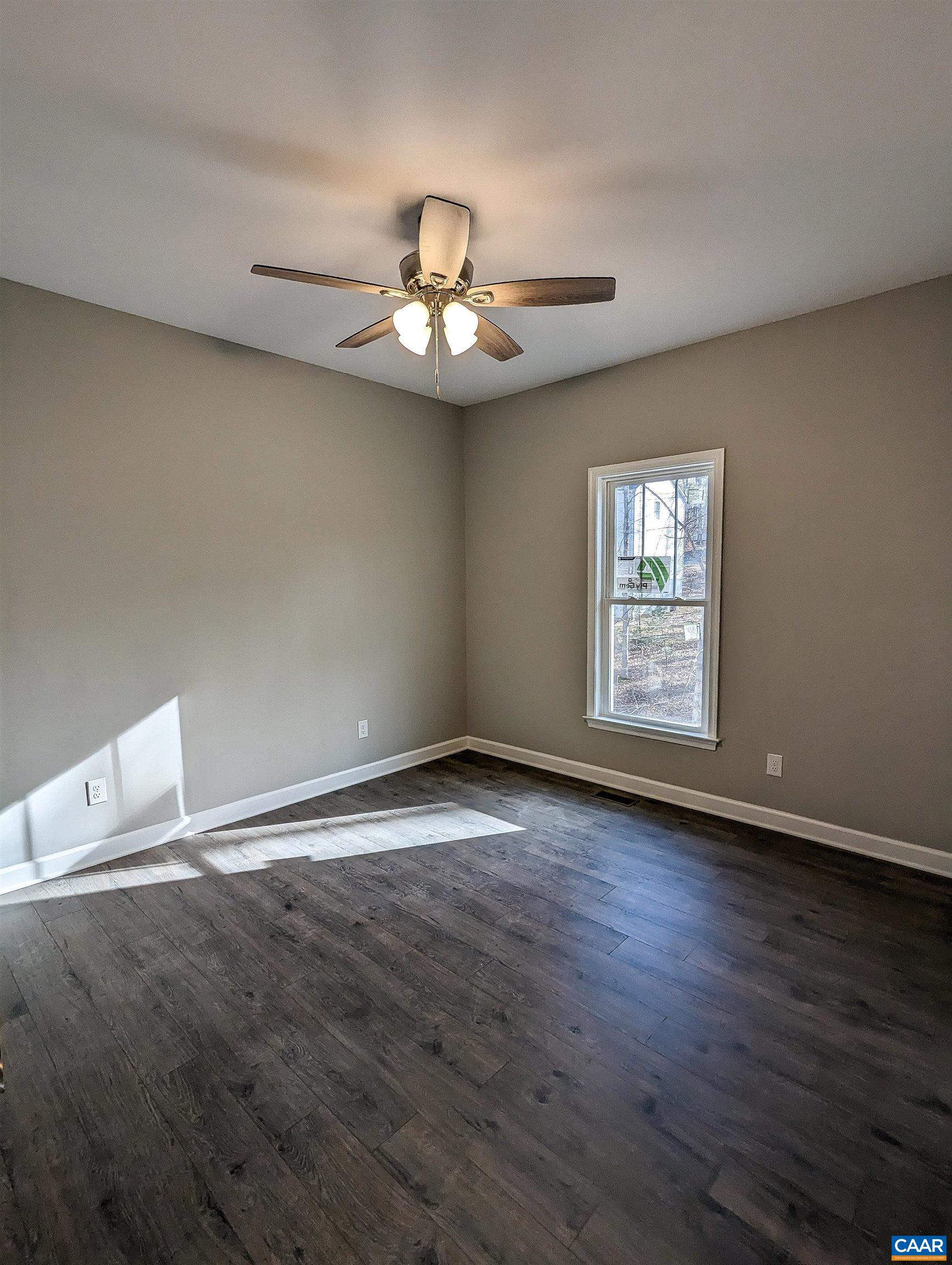 13 Amethyst Road Palmyra, VA 22963 - Photo 15 of 39 an empty room with wooden floor fan and windows
