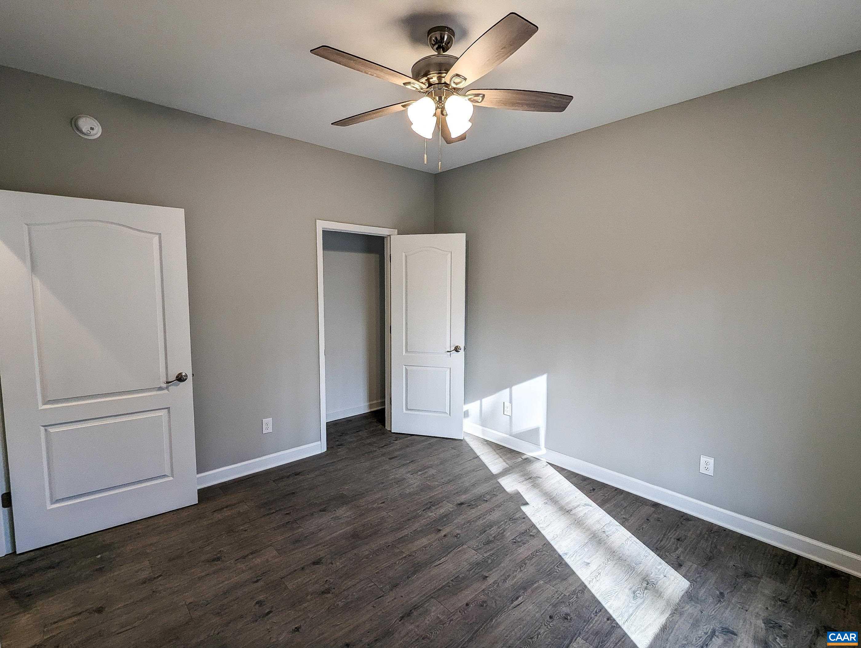 13 Amethyst Road Palmyra, VA 22963 - Photo 23 of 39 wooden floor in an empty room with a window