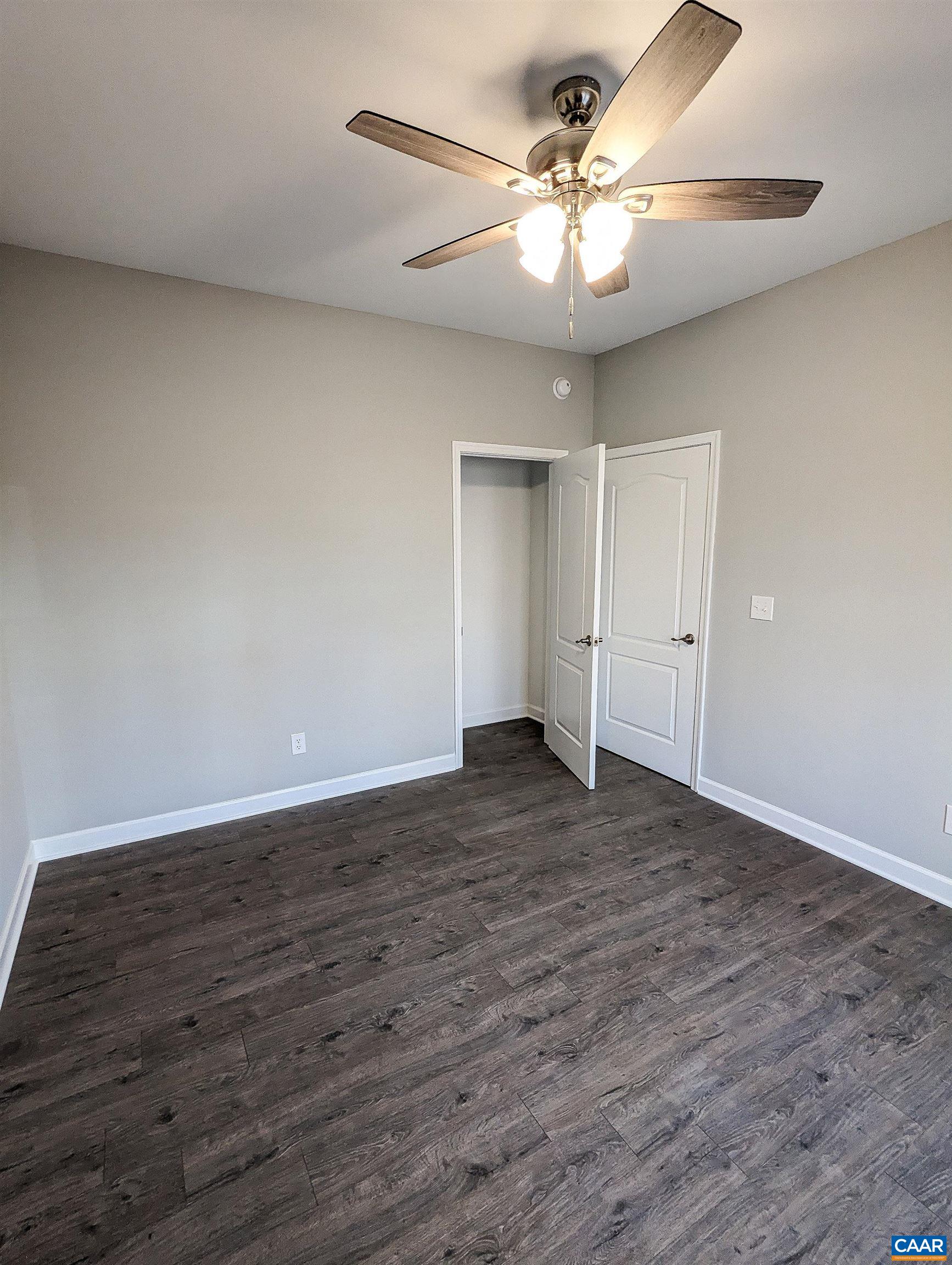 13 Amethyst Road Palmyra, VA 22963 - Photo 25 of 39 a view of a livingroom with a chandelier fan and wooden floor
