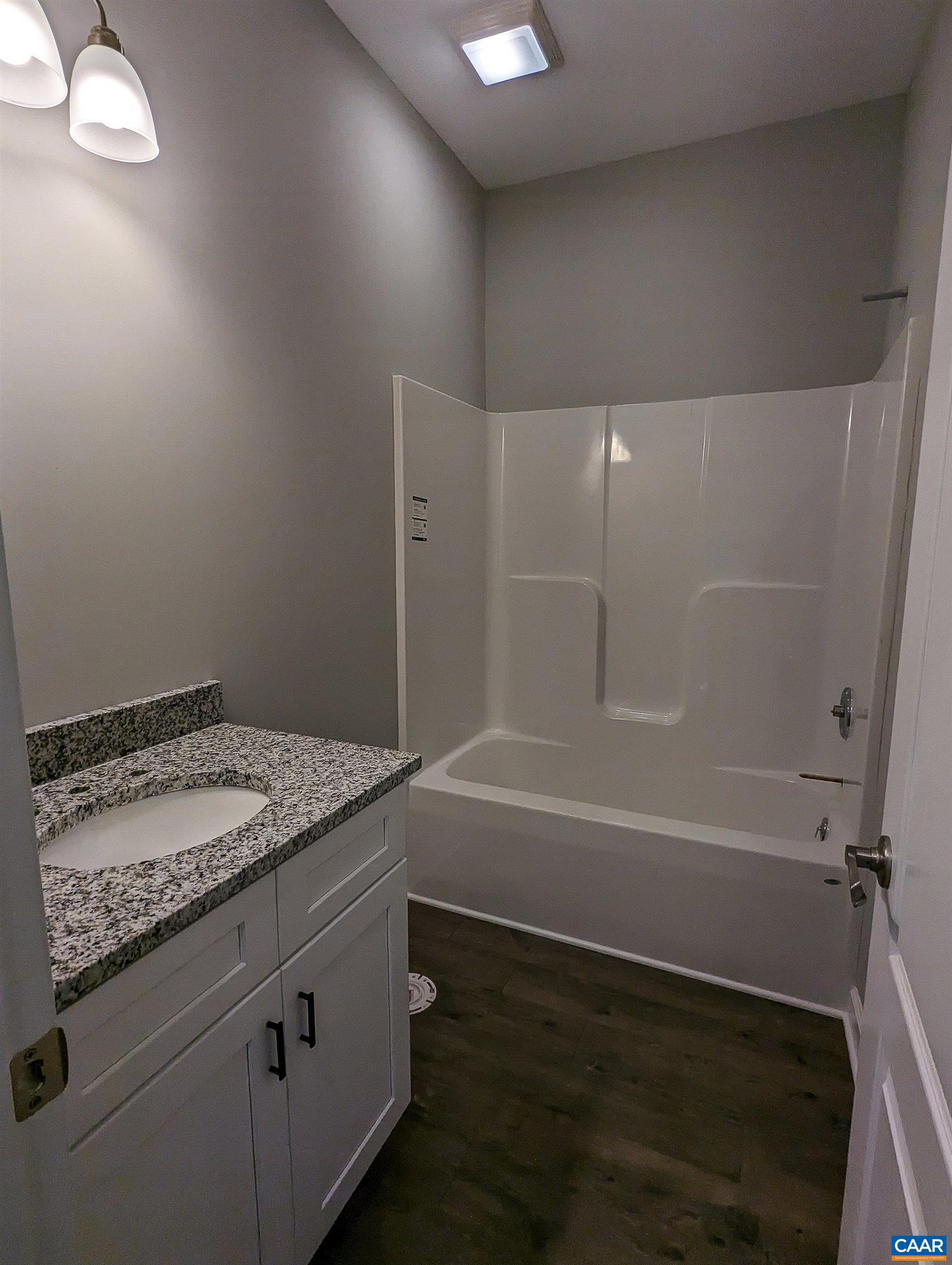 13 Amethyst Road Palmyra, VA 22963 - Photo 26 of 39 a bathroom with a granite countertop sink and a mirror