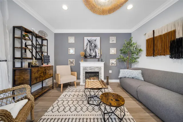 a living room with furniture and a fireplace
