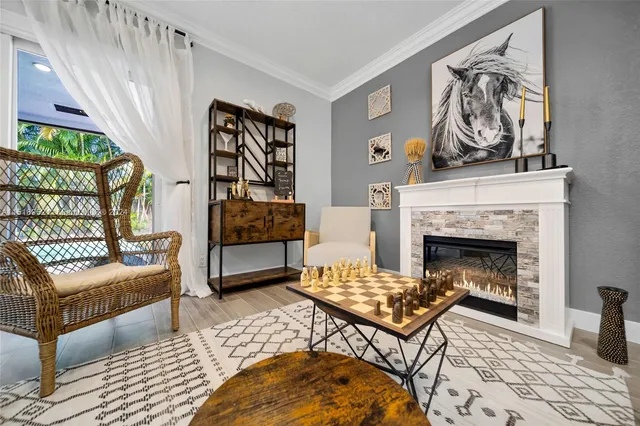 a living room with furniture a rug and a fireplace