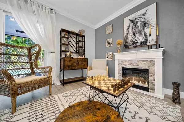 a living room with furniture and a fireplace