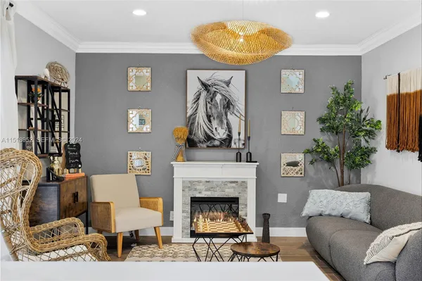 a living room with furniture and a fireplace
