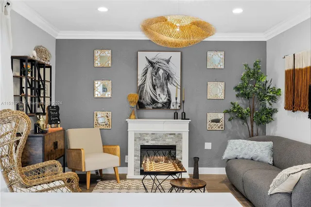 a living room with furniture and a fireplace