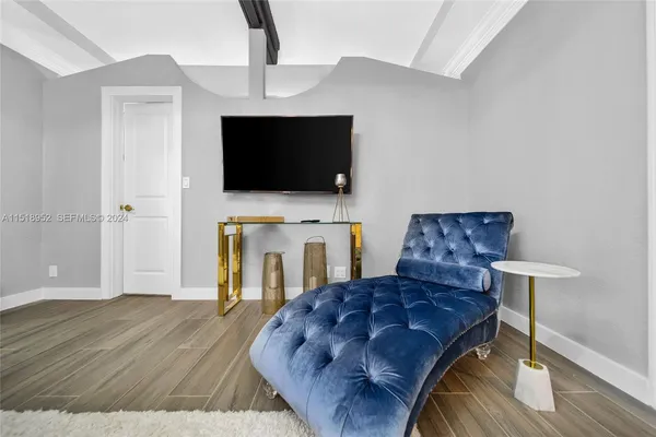 a living room with a fireplace furniture and a flat screen tv