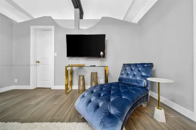 a living room with a fireplace furniture and a flat screen tv