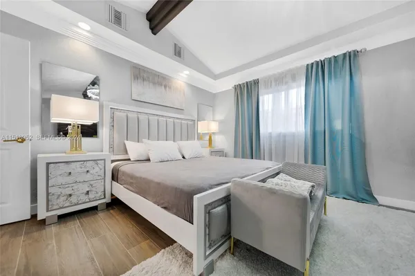 a bed room with a bed and a night stand