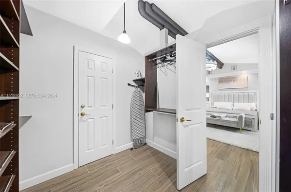 a view of kitchen with furniture and wooden floor