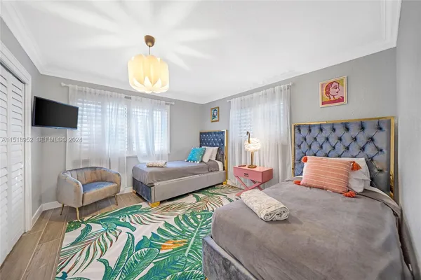 a bedroom with a bed and a couch