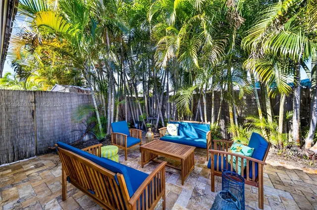 a view of an outdoor sitting area with furniture