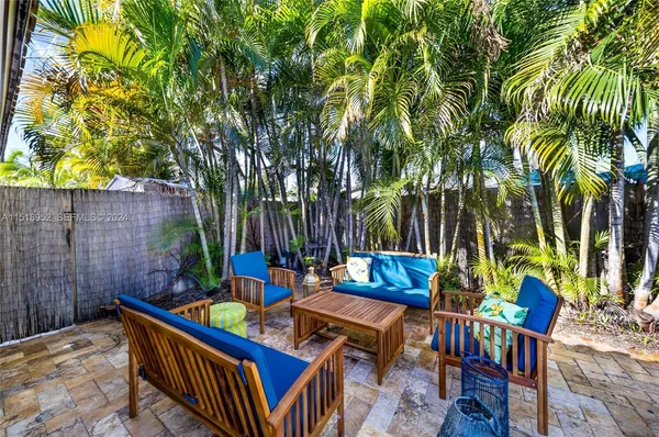 a view of an outdoor sitting area with furniture