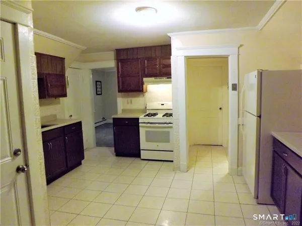 a kitchen with stainless steel appliances a stove a refrigerator and a sink