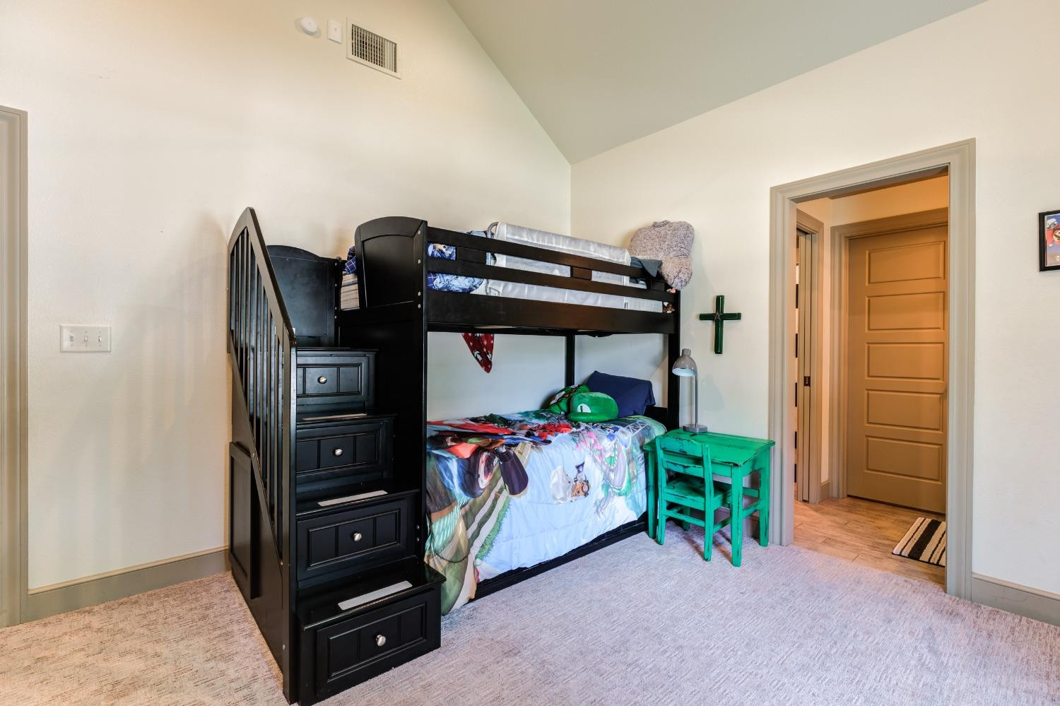 4808 115th Street Lubbock, TX 79424 - Photo 22 of 50 a bedroom with a bed and a ceiling fan