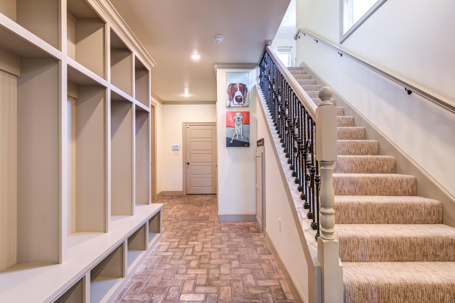 4808 115th Street Lubbock, TX 79424 - Photo 27 of 50 a view of staircase with lots of frames on wall and a wooden floor