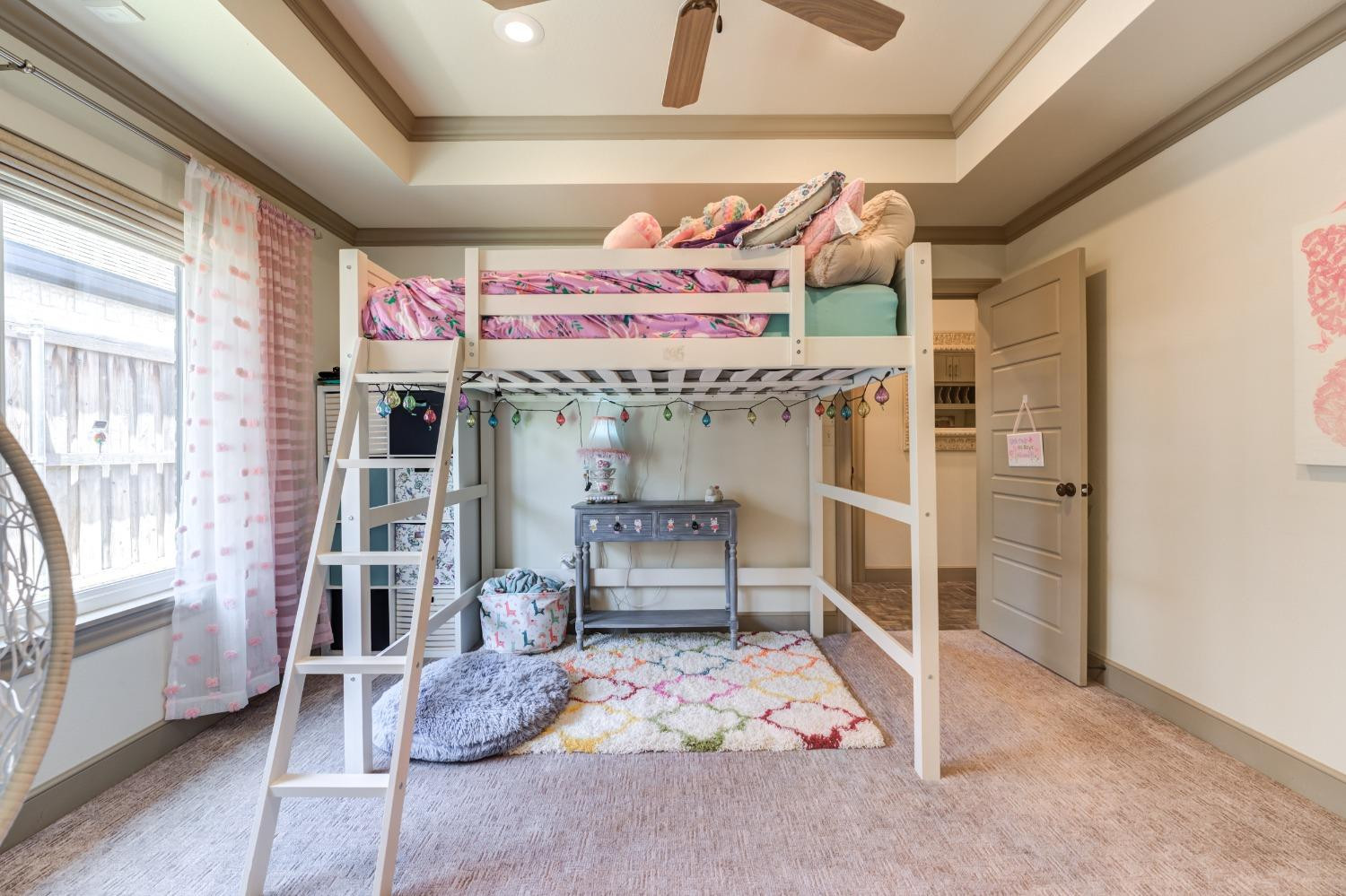 4808 115th Street Lubbock, TX 79424 - Photo 35 of 50 a bedroom with furniture and a chandelier