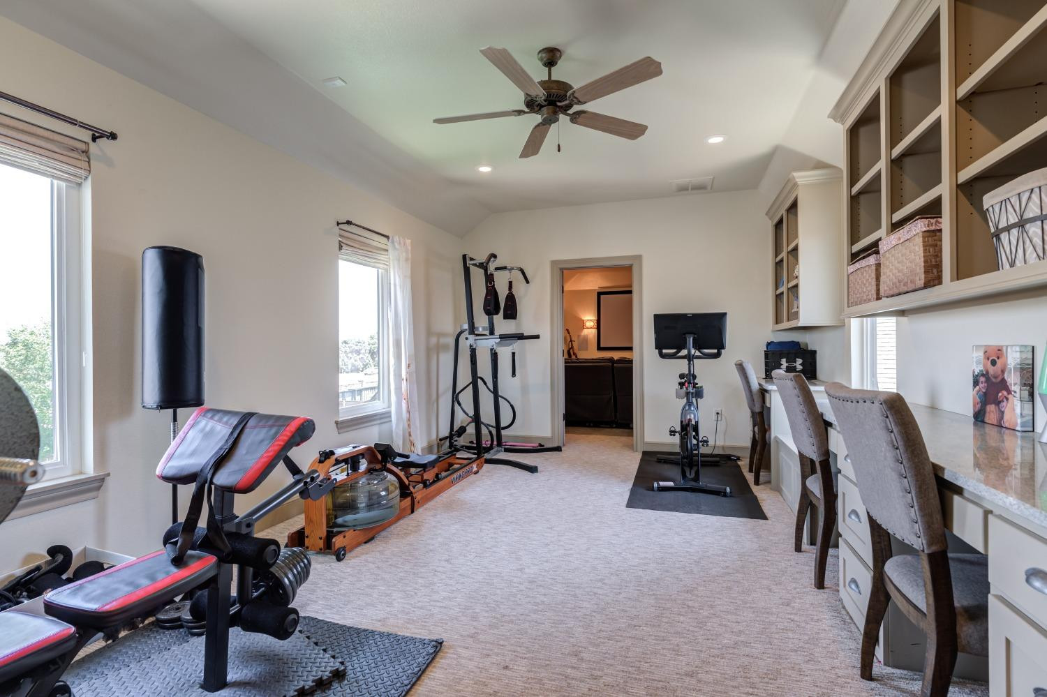4808 115th Street Lubbock, TX 79424 - Photo 38 of 50 a view of a room with gym equipment