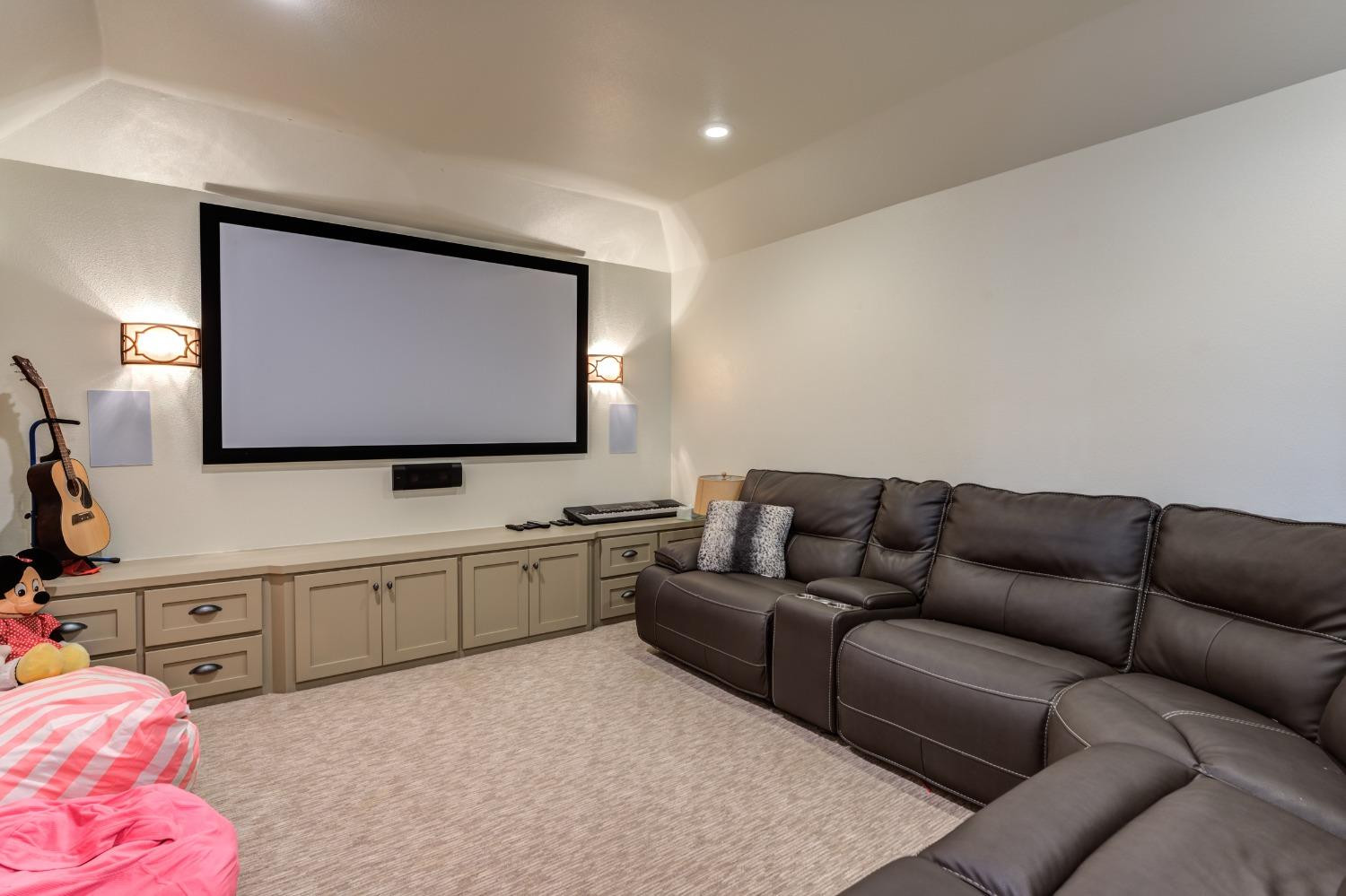4808 115th Street Lubbock, TX 79424 - Photo 42 of 50 a living room with furniture and a flat screen tv