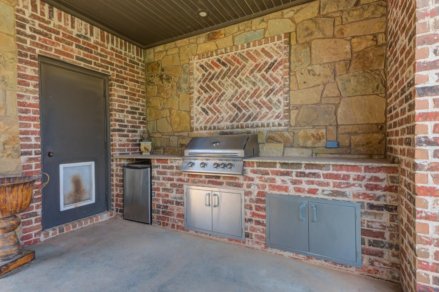 4808 115th Street Lubbock, TX 79424 - Photo 45 of 50 a kitchen with a stove and a cabinets