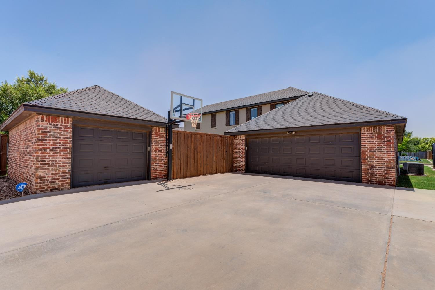 4808 115th Street Lubbock, TX 79424 - Photo 50 of 50 a front view of a house with a yard and garage