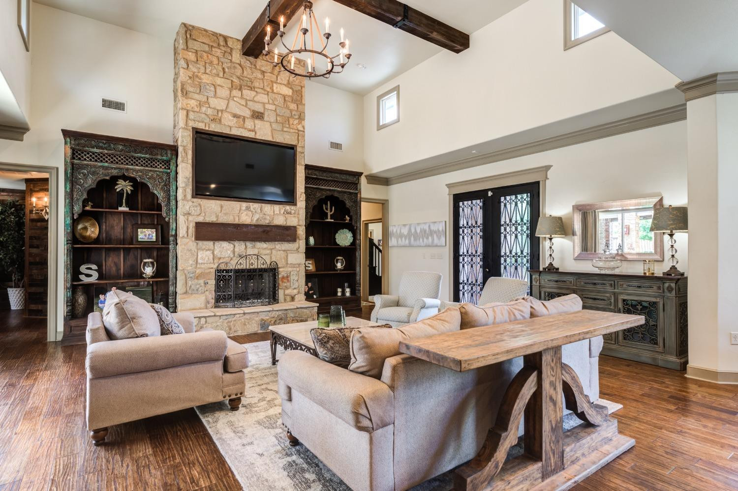 4808 115th Street Lubbock, TX 79424 - Photo 8 of 50 a living room with fireplace furniture and a wooden floor