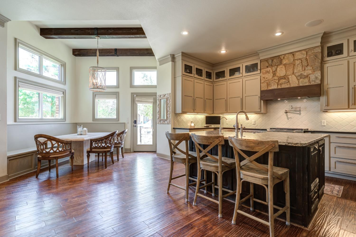 4808 115th Street Lubbock, TX 79424 - Photo 9 of 50 a dining table with chairs and wooden floor
