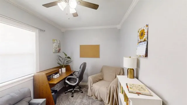 a living room with furniture and a chair