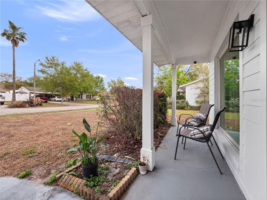 2733 Middle Street Orlando, FL 32807 - Photo 4 of 23 a balcony with furniture and a potted plant