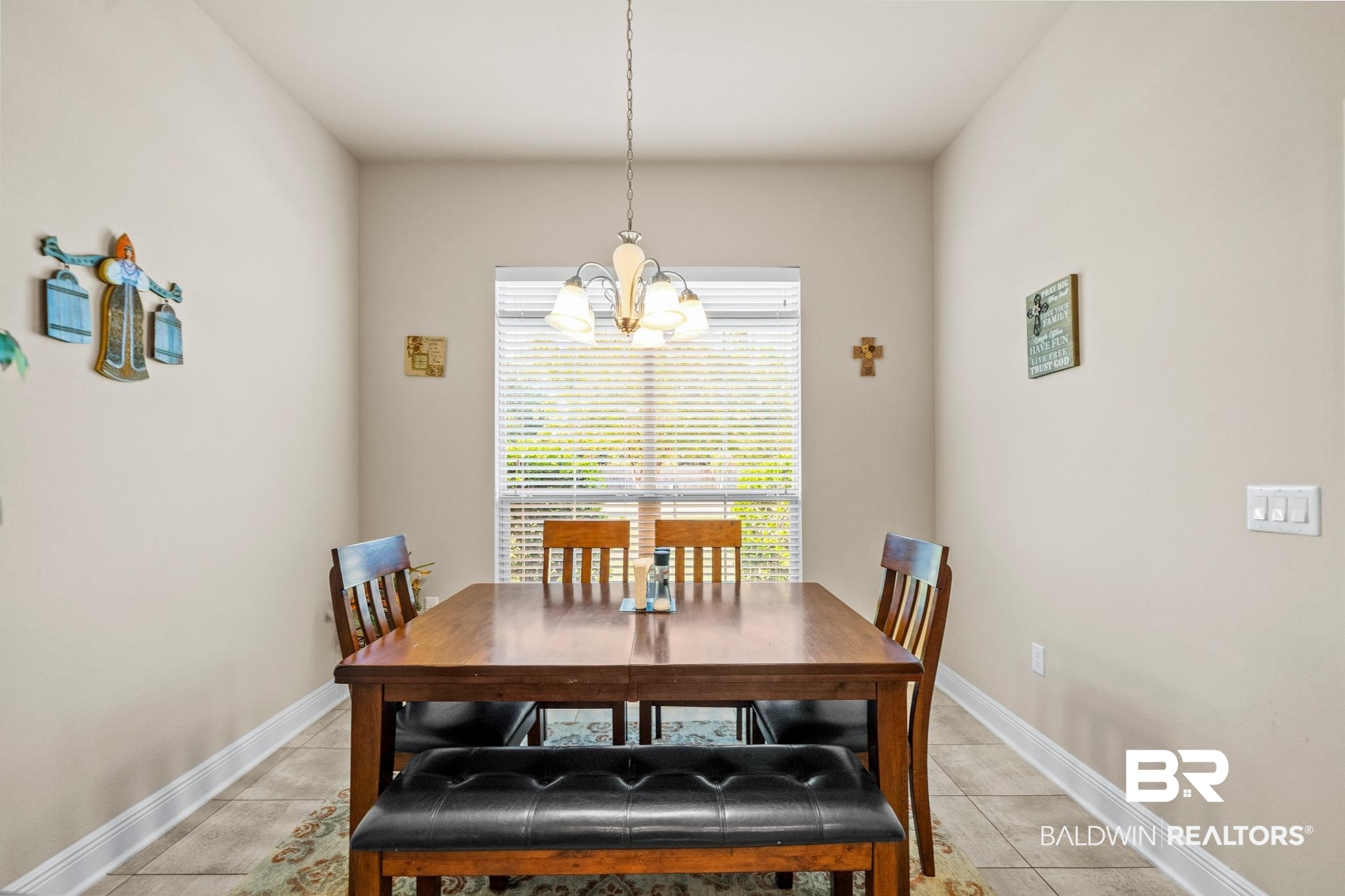 17069 Russet Court Foley, AL 36535 - Photo 10 of 27 Dining space featuring light tile patterned flooring and a chandelier
