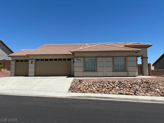 2866 Shimmering Bay Street Laughlin, NV 89029 - Photo 1 of 32 A well-maintained single-story residence with an attached garage and desert landscaping.