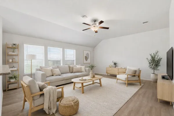 a living room with furniture and a large window