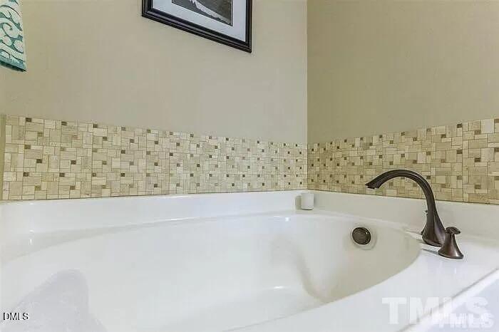2436 Baslow Drive Apex, NC 27539 - Photo 17 of 21 a bathroom with a bathtub