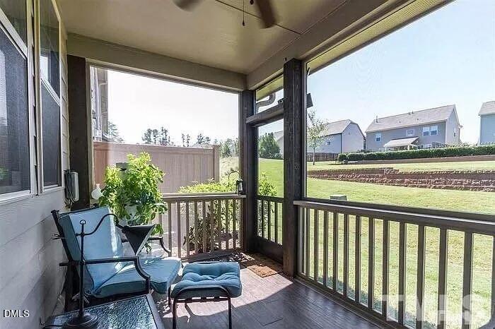2436 Baslow Drive Apex, NC 27539 - Photo 19 of 21 a view of a chair and table in the balcony