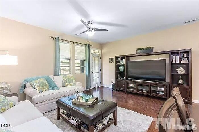 2436 Baslow Drive Apex, NC 27539 - Photo 5 of 21 a living room with furniture and a flat screen tv