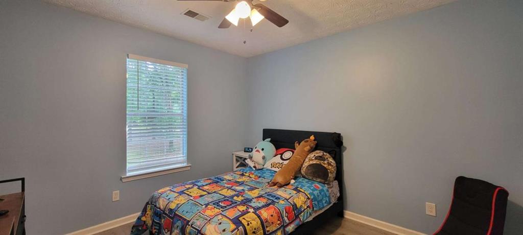 2140 Summerset Drive Monroe, GA 30656 - Photo 19 of 43 a bedroom with a bed and a window