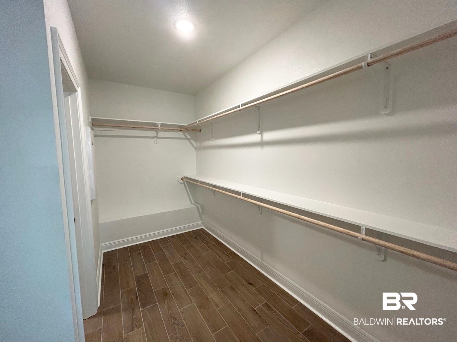 872 Sumter Loop Foley, AL 36535 - Photo 9 of 18 Walk in closet with dark wood-type flooring