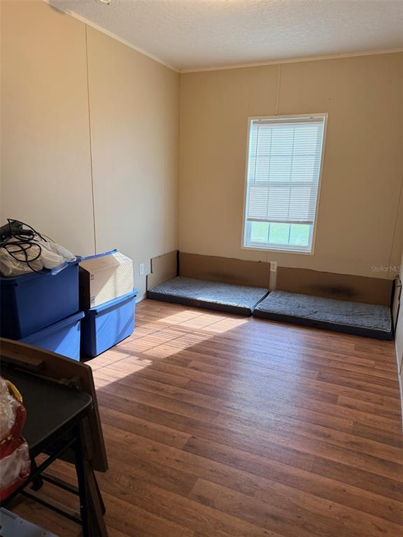 10730 198th Terrace O'Brien, FL 32071 - Photo 20 of 29 a living room with hard wood floors and a window