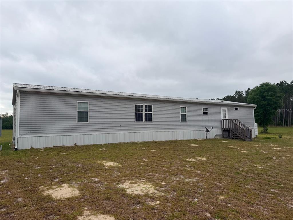 10730 198th Terrace O'Brien, FL 32071 - Photo 25 of 29 a house view with a outdoor space